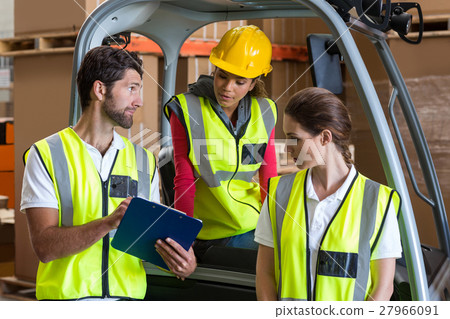 Portrait of workers are looking a clipboard 27966091