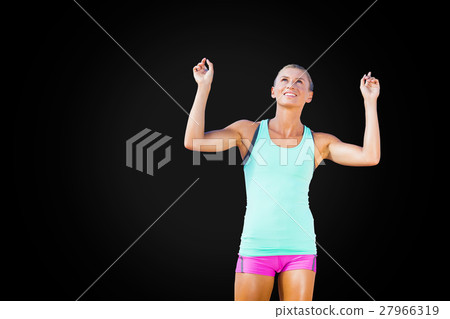 Front view of happy sportswoman raising arms 27966319