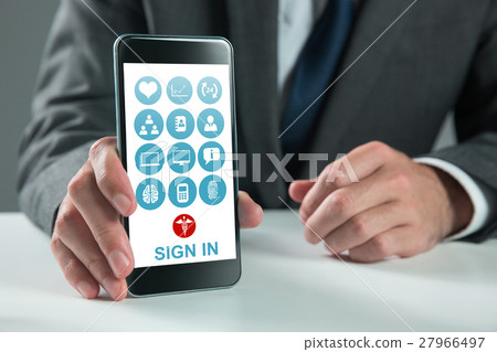Composite image of businessman using smartphone 27966497