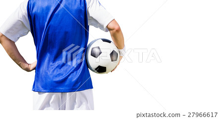 Rear view of football player holding a football 27966617