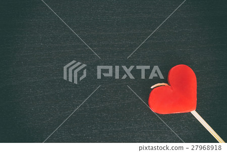 Valentines heart candle on black wood 27968918
