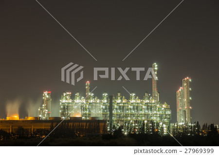 Oil refinery industrial plant at night 27969399