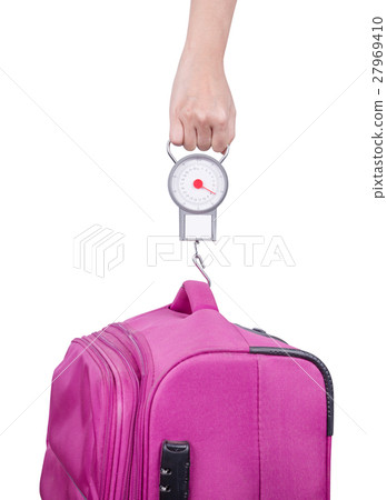 Passenger checking luggage weight with scale  27969410