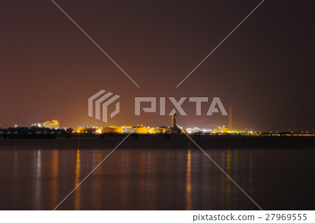 electrical power plant near sea coat at night electrical power plant near sea coat at night 27969555