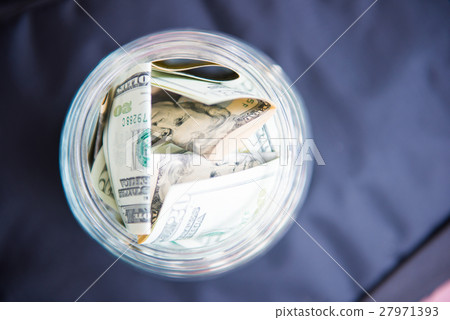 saving money in jar with American dollors saving money in jar with American dollors 27971393
