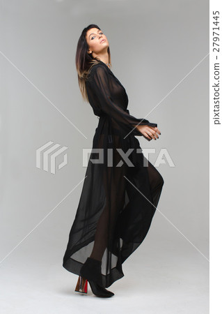 Model diaphanous nightie playfully looking camera Model diaphanous nightie playfully looking camera 27971445