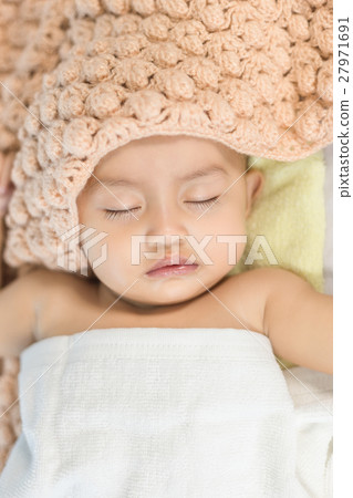 Baby sleeping on bed in the bedroom Baby sleeping on bed in the bedroom 27971691
