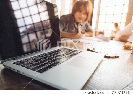Top view of working table in coffee shop with warm 27973236