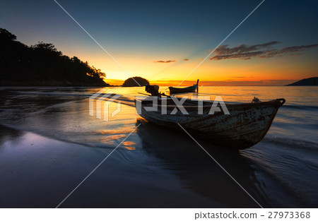 Small boat at the Andaman Sea  at sunset 27973368