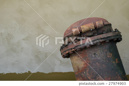 Water discharge pipe  canal in the city 27974903