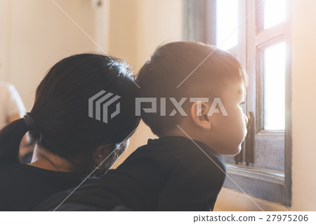 Asian boy and mother standing at a sun light Asian boy and mother standing at a sun light 27975206