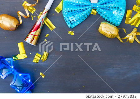 Masquerade decorations on dark wooden background Masquerade decorations on dark wooden background 27975832