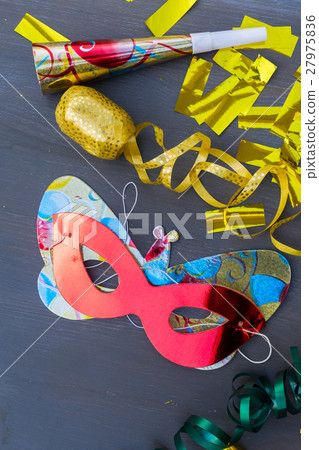 Masquerade decorations on dark wooden background Masquerade decorations on dark wooden background 27975836