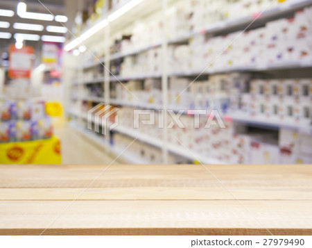 Wooden board empty table over blur in supermarket Wooden board empty table over blur in supermarket 27979490