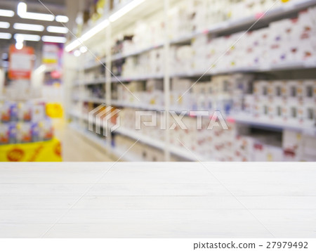 Wooden board empty table over blur in supermarket Wooden board empty table over blur in supermarket 27979492