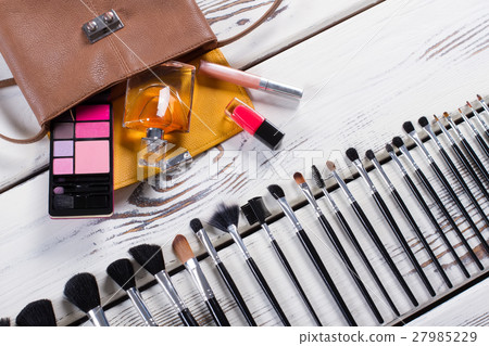 Women's accessories on a wooden background. 27985229