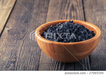 Crystal flakes of black natural sea salt. 27985544