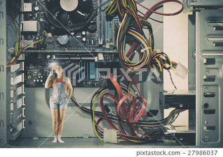 Little female with a flashlight inside a computer 27986037
