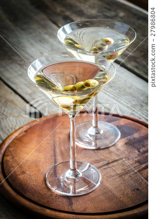 Two olive martini cocktails 27986804