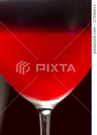 Wineglass with cold red wine Wineglass with cold red wine 27986851