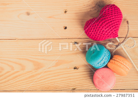 colorful dessert macarons on wood table. colorful dessert macarons on wood table. 27987351