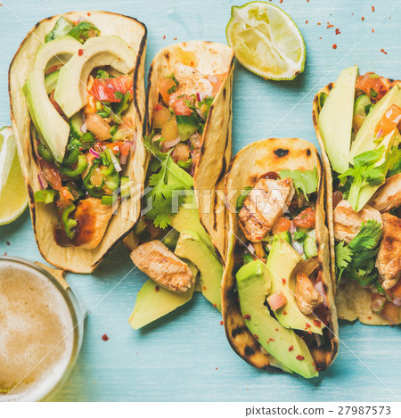 Healthy corn tortillas and beer over blue 27987573