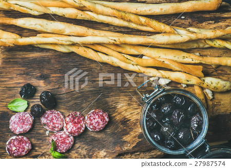 Grissini bread sticks, sausage, black olives on Grissini bread sticks, sausage, black olives on 27987574