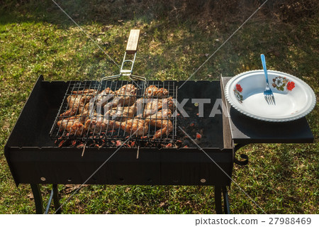 Chicken wings on the grill. Chicken wings on the grill. 27988469