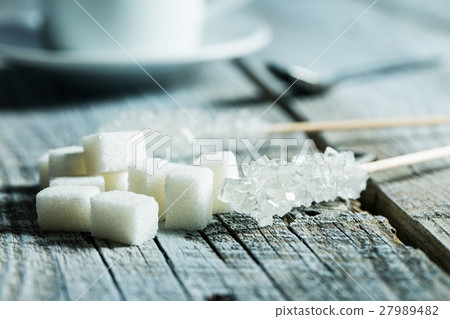 Crystallized sugar on wooden stick. Crystallized sugar on wooden stick. 27989482