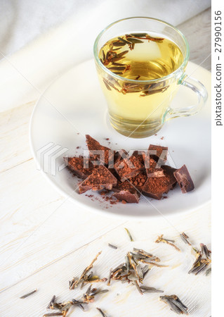 cup green tea and slices of chocolate cup green tea and slices of chocolate 27990156