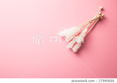 Crystallized sugar on wooden stick. Crystallized sugar on wooden stick. 27990688