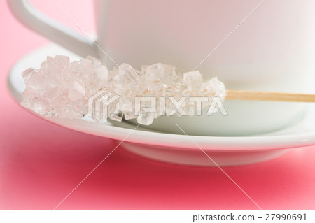 Crystallized sugar on wooden stick. Crystallized sugar on wooden stick. 27990691