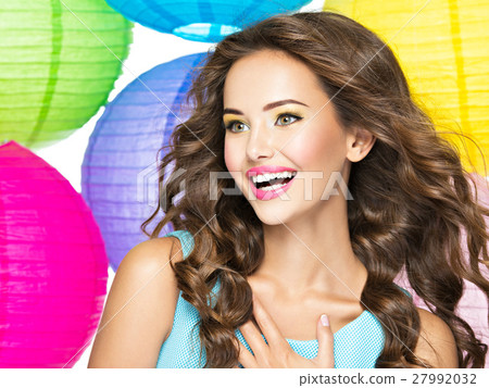Portrait of happy young girl with long brown hair 27992032