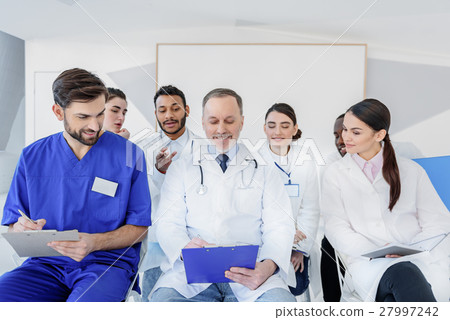 Senior physician making medical explanation for 27997242