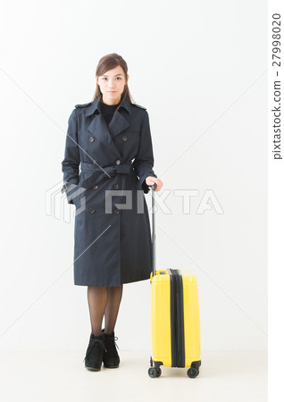 A woman with a suitcase A woman with a suitcase 27998020