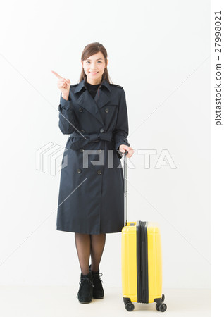A woman with a suitcase A woman with a suitcase 27998021