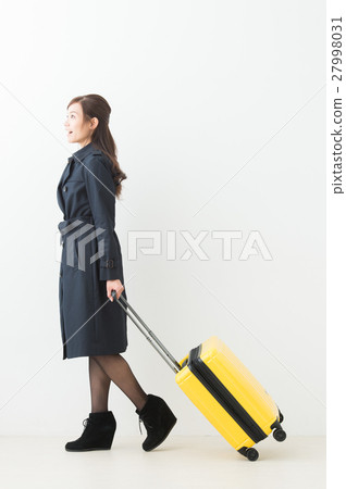 A woman with a suitcase 27998031