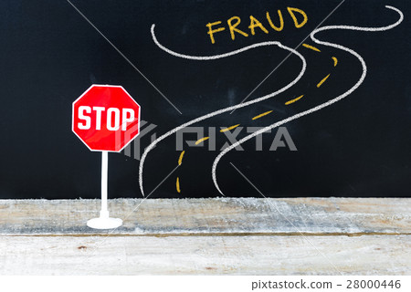 Mini STOP sign on the road to FRAUD 28000446