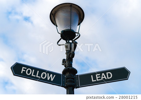 Follow versus Lead directional signs on guidepost Follow versus Lead directional signs on guidepost 28001215