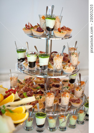 Pyramid of different salads in glasses 28003203