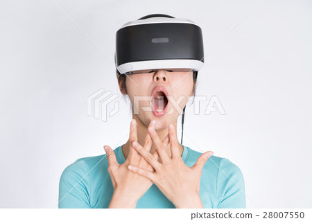 Women wearing a VR headset Women wearing a VR headset 28007550