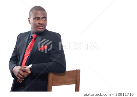 African man seriously posing and looking away. 28011716