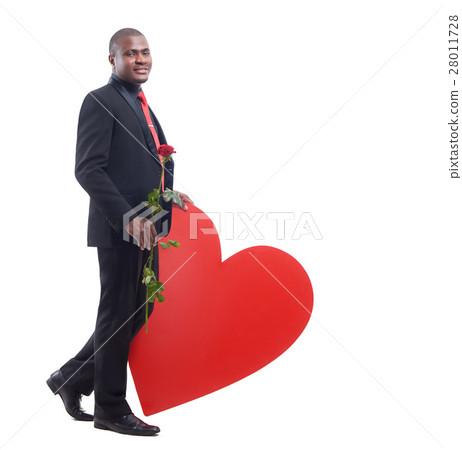 Male leaning of big red heart at studio. 28011728