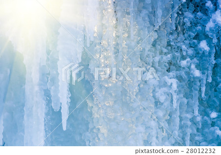 blue ice and frozen icicles, winter background blue ice and frozen icicles, winter background 28012232