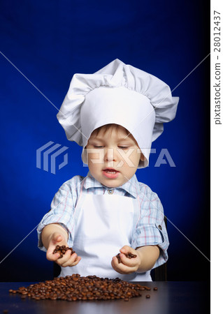 little boy checking coffee grains little boy checking coffee grains 28012437