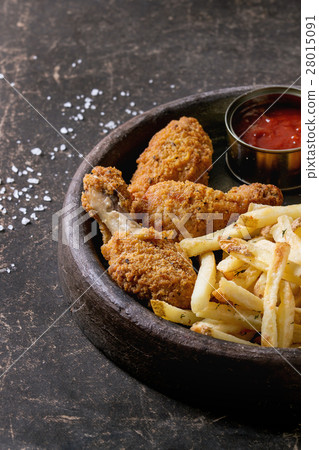 Fried chicken legs with french fries 28015091