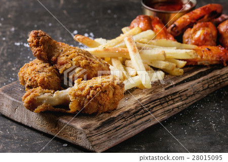 Fried chicken legs with french fries 28015095