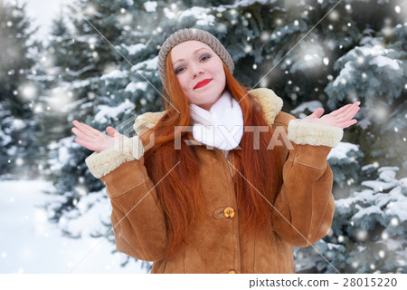 beautiful woman on winter outdoor, snowy fir trees 28015220