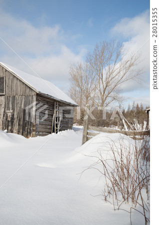 Old farm building on a sunny winter day landscape 28015355
