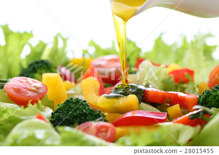 Apply olive oil to vegetable salad Apply olive oil to vegetable salad 28015455